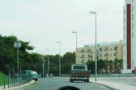 Urban street with a small truck ahead