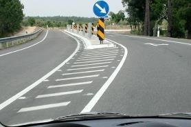 Hatched lane divider with a keep right sign