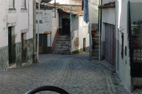 Narrow cobbled village street with very poor visibility